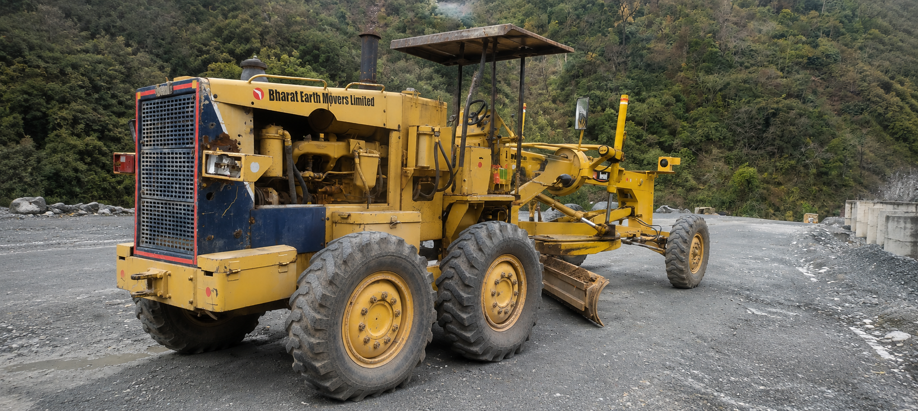 Motor grader levelling ground on a road construction site
